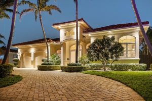 Twilight real estate photography of the front exterior at 371 SE 15th Avenue, Pompano Beach, FL