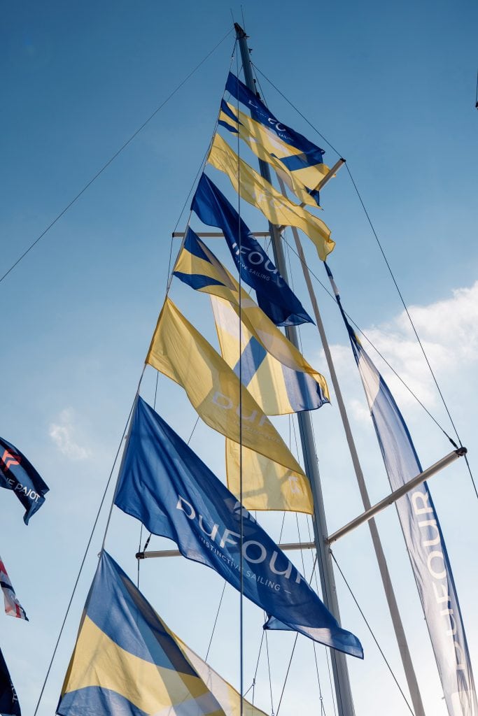 Colorful yacht flags flying at Miami Boat Show in South Florida.