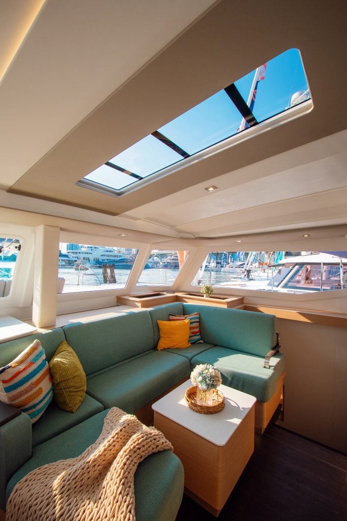 Elegant yacht lounge with skylight and marina views in South Florida.