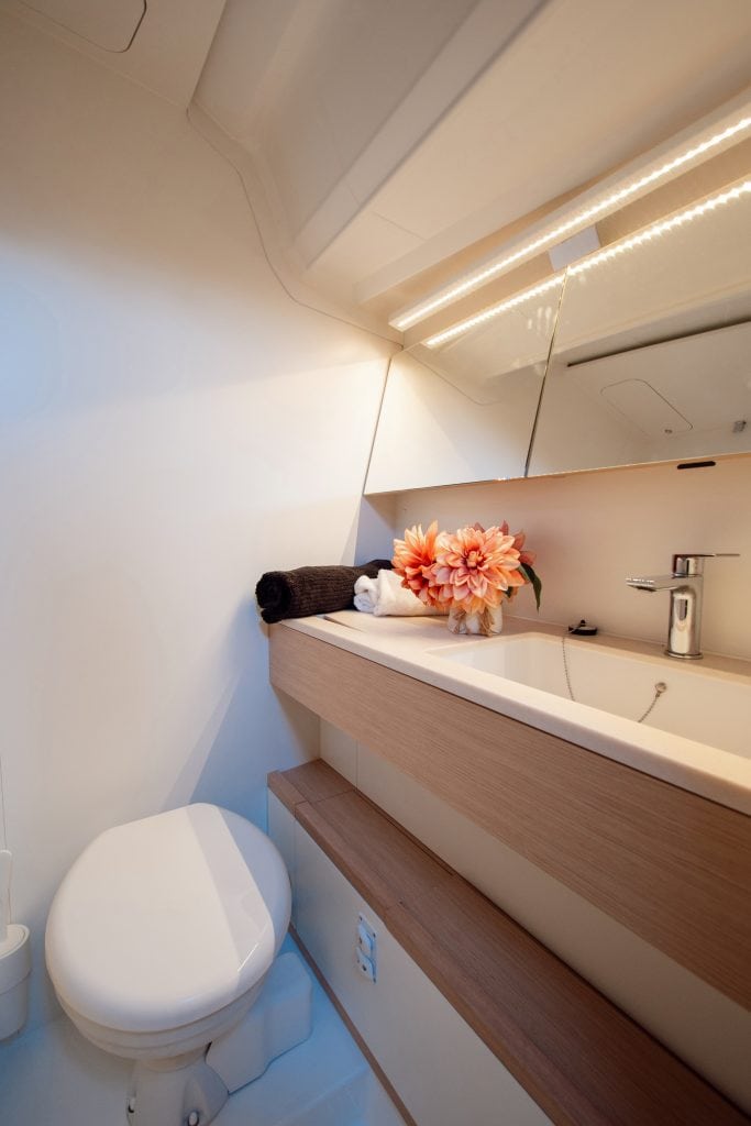 Modern yacht bathroom with sleek design and elegant decor.