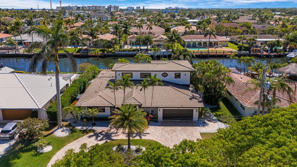 Waterfront residential properties with lush landscaping and scenic views.