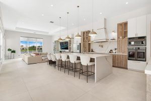 Bright open-concept kitchen with island, modern appliances, and spacious living area.