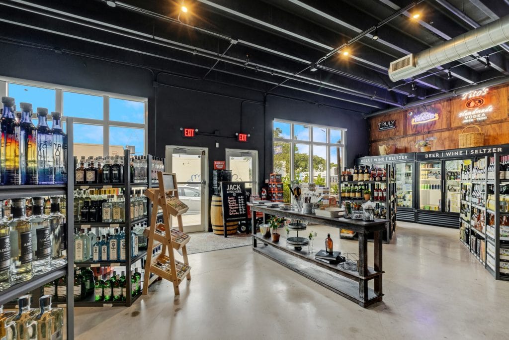 Modern craft beer and seltzer store interior with shelves and coolers.