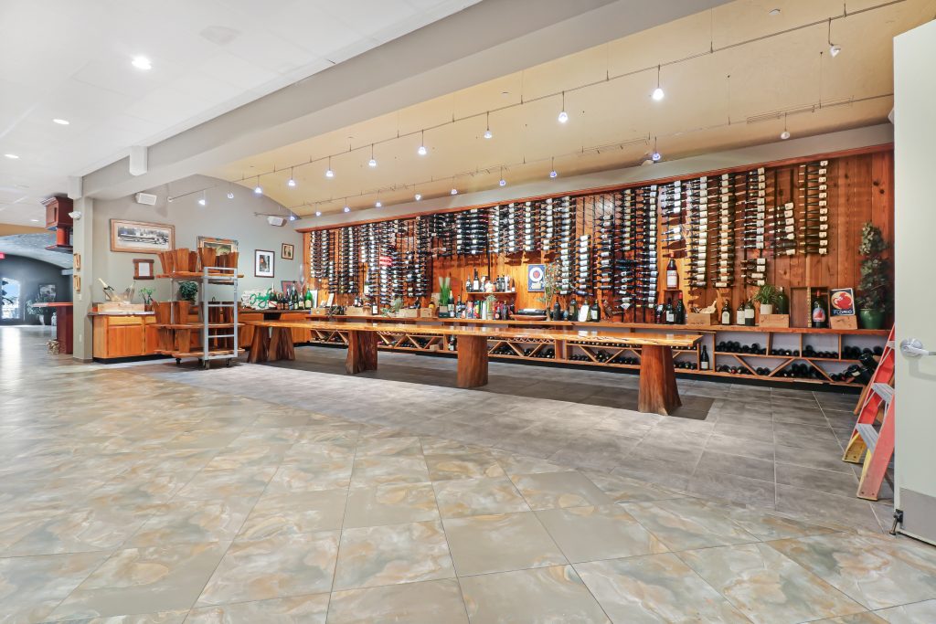 Wine cellar with wooden racks and bottles for wine storage and tasting.