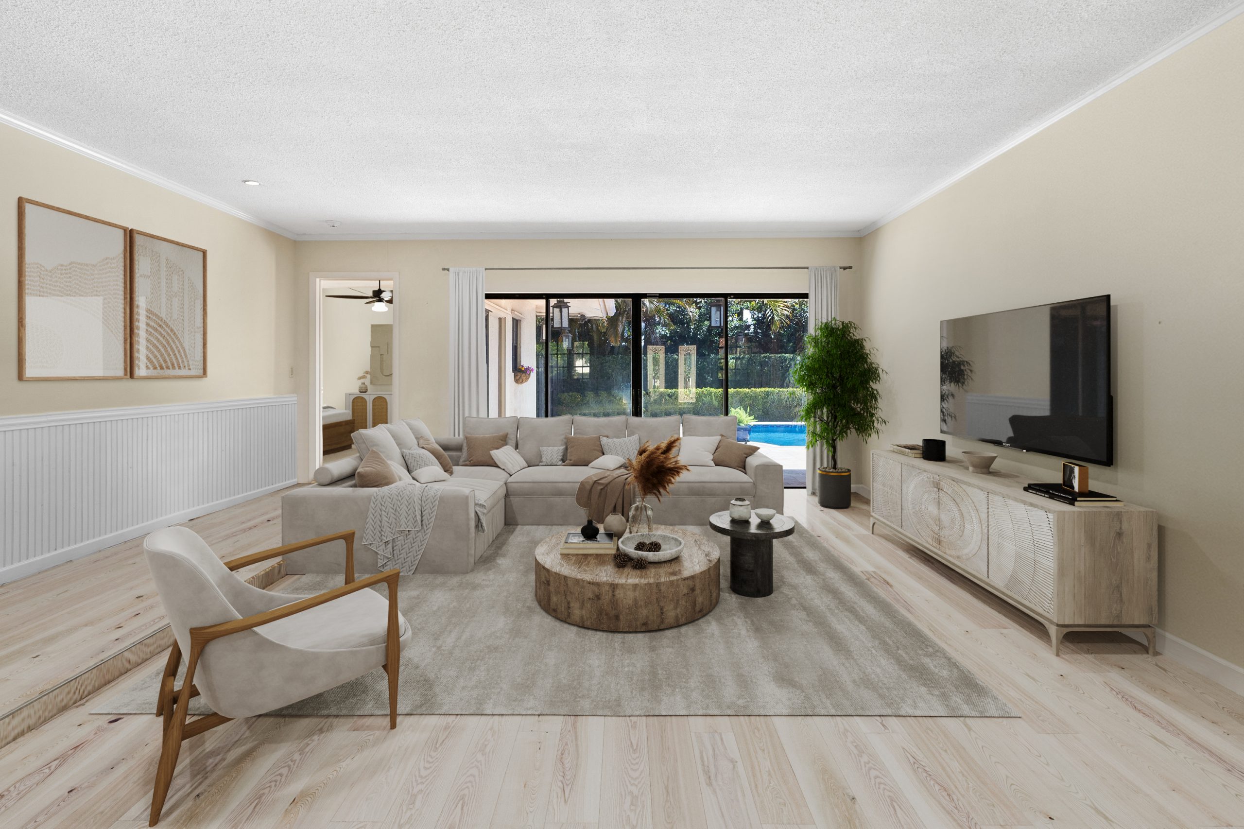 Spacious living room featuring a large window, comfortable sectional sofa, and stylish decor for a w.