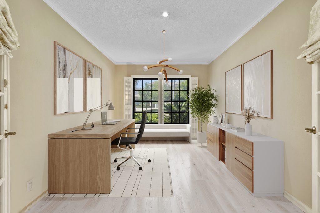 Home office with large window, minimalist furniture, and bright, airy atmosphere.