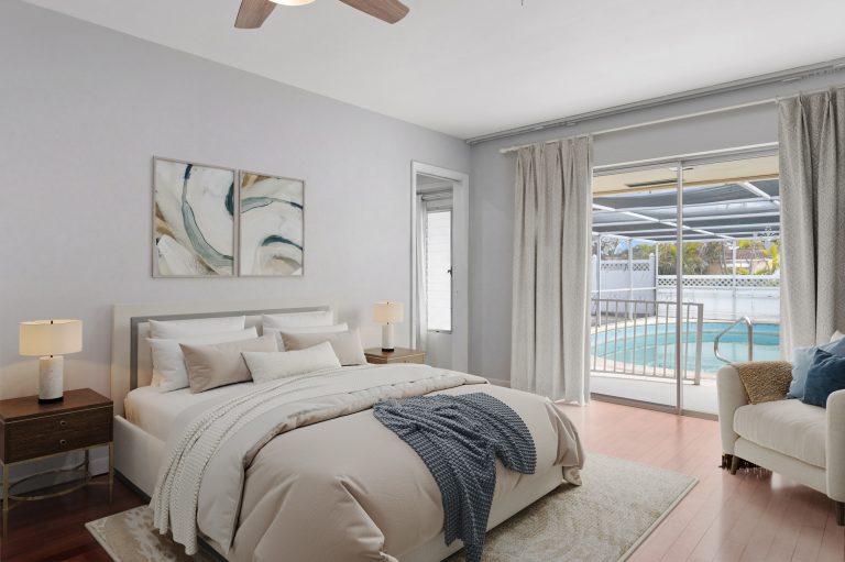 Bright bedroom with pool view, modern decor, and sliding glass door at AccuTour.com.