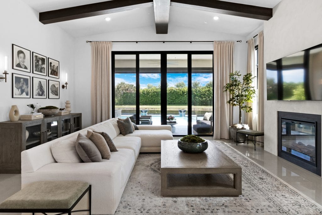 Bright living room with large glass doors overlooking a scenic outdoor view.