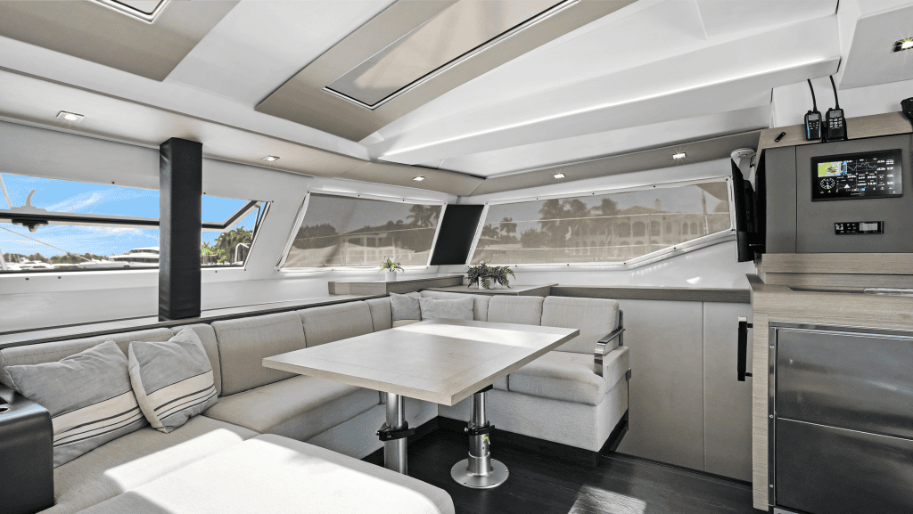 Elegant yacht interior with spacious seating and panoramic windows.