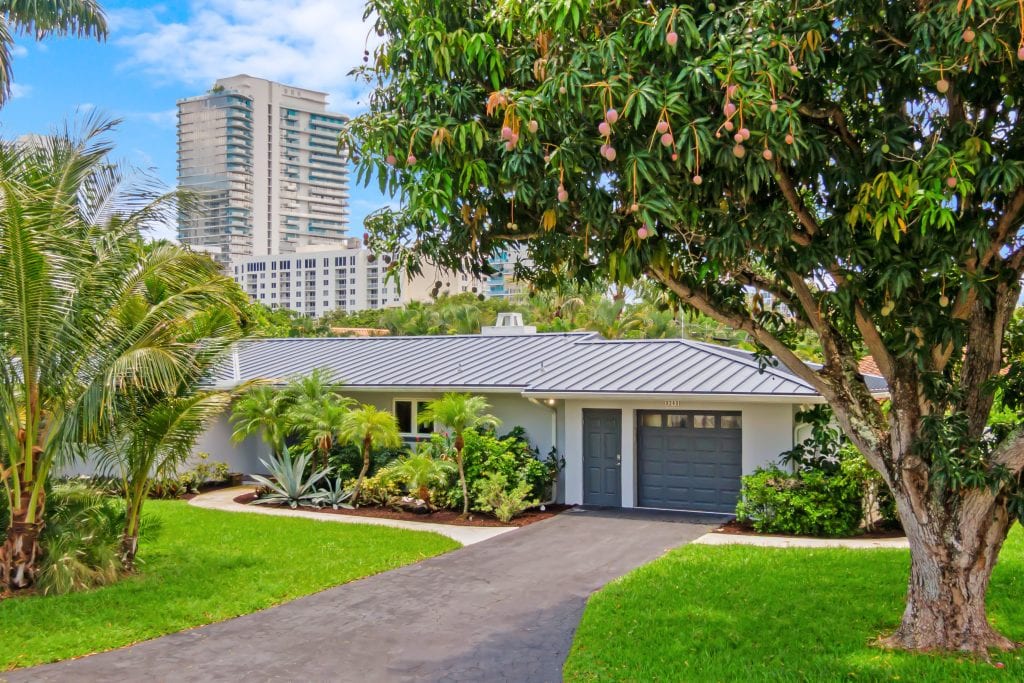 Beautiful suburban home with a well-maintained garden and driveway.