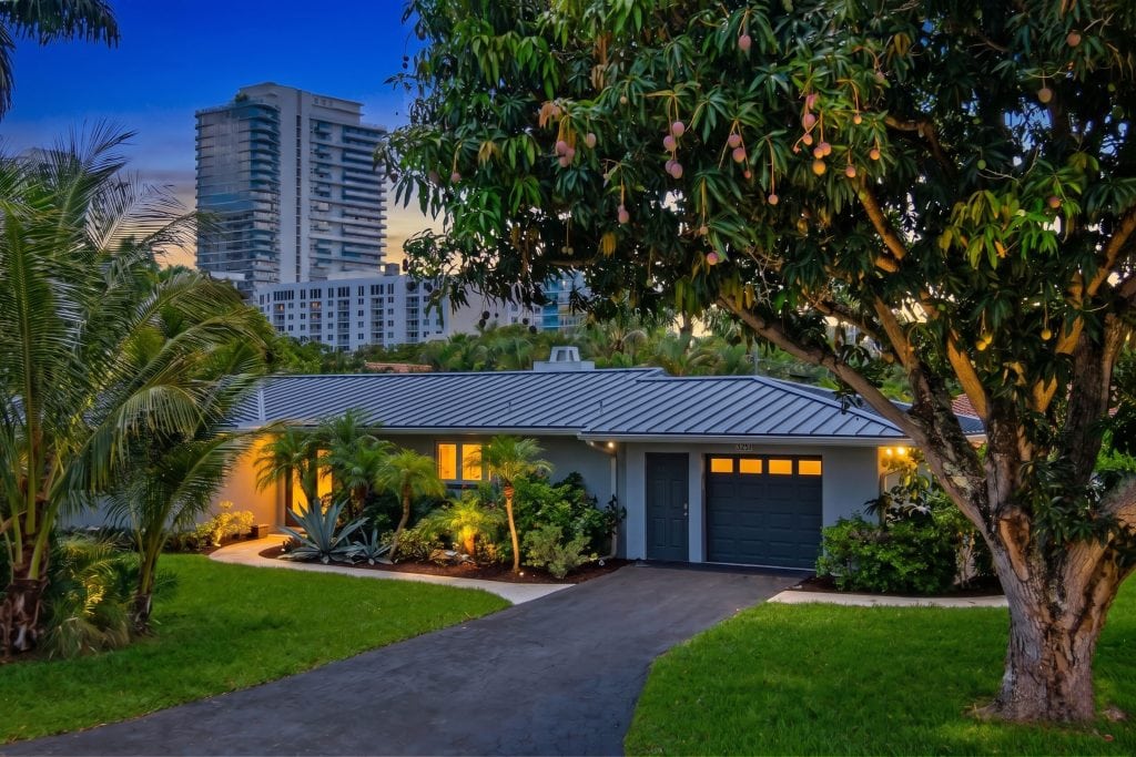 Beautiful suburban home with a well-maintained garden and driveway.