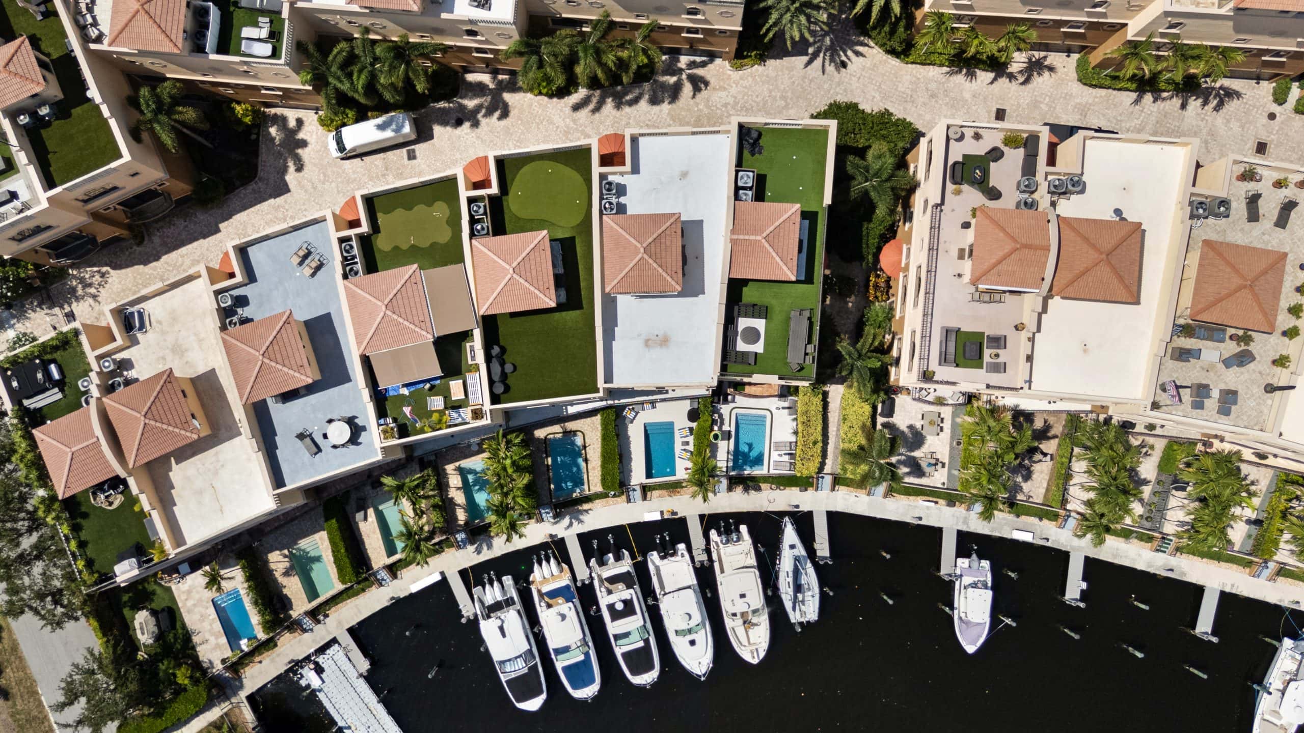Aerial view of waterfront homes and boats in Pompano Beach, FL.
