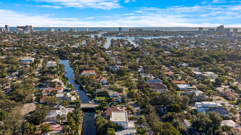 Aerial view of Fort Lauderdale neighborhoods with waterways and lush greenery.