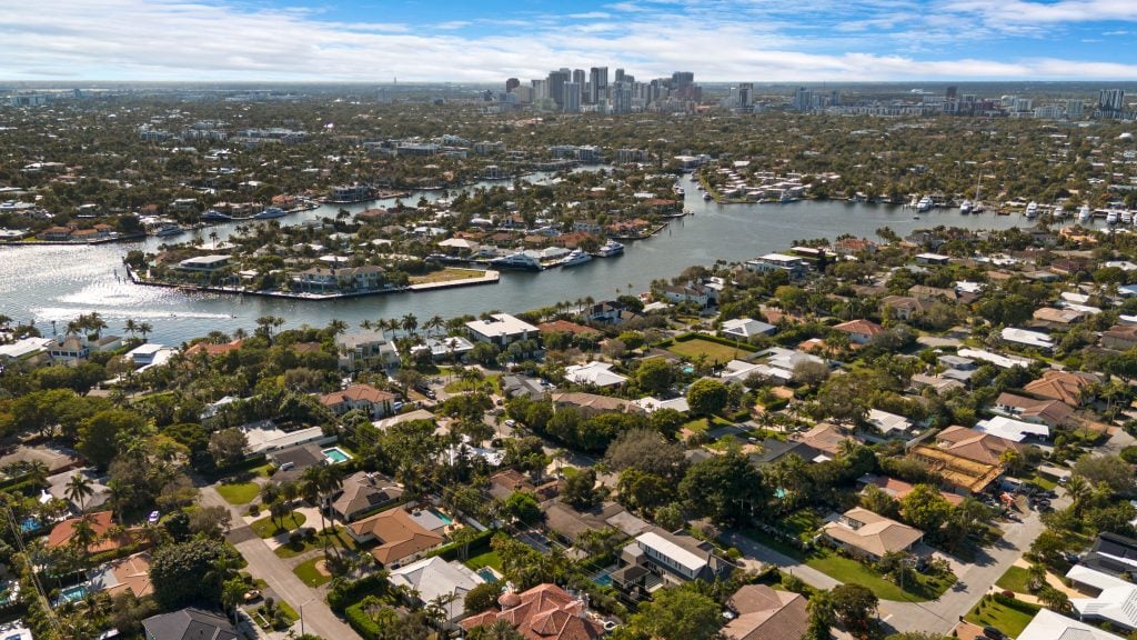 Aerial view of Fort Lauderdale neighborhoods with waterway and city skyline.