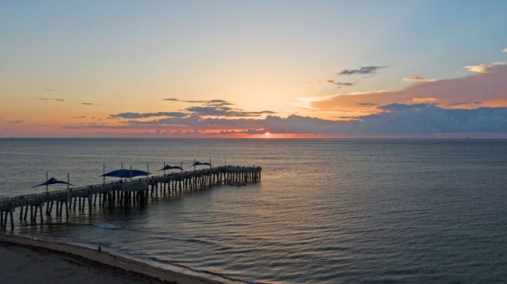 Scenic sunset view over the ocean at Pompano Beach, Florida.