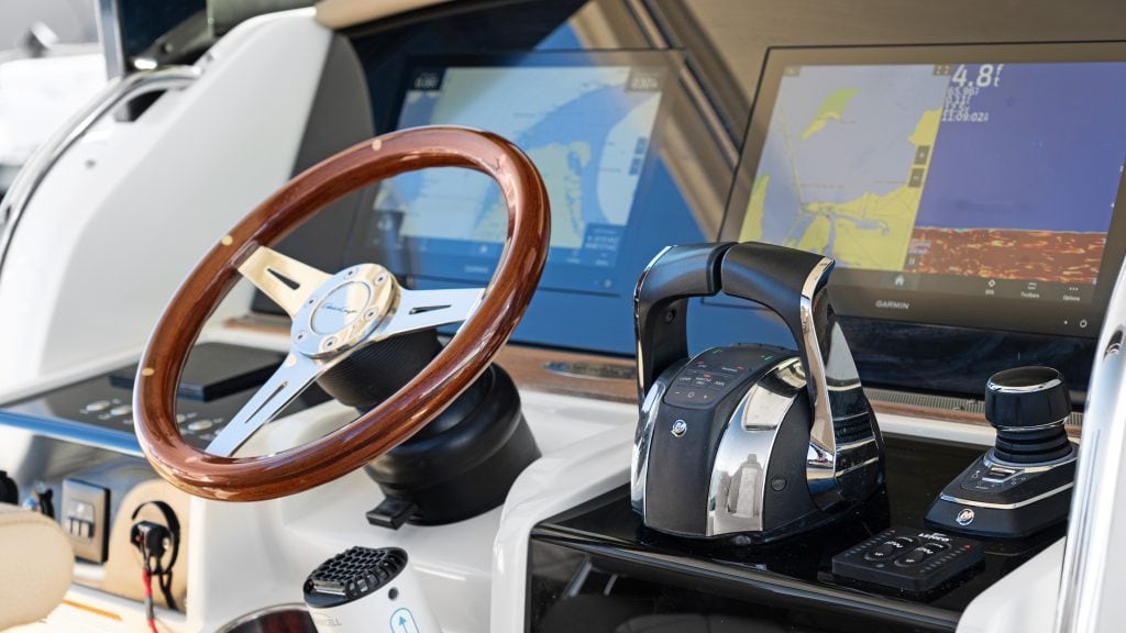Marine navigation system with multiple screens and control devices.