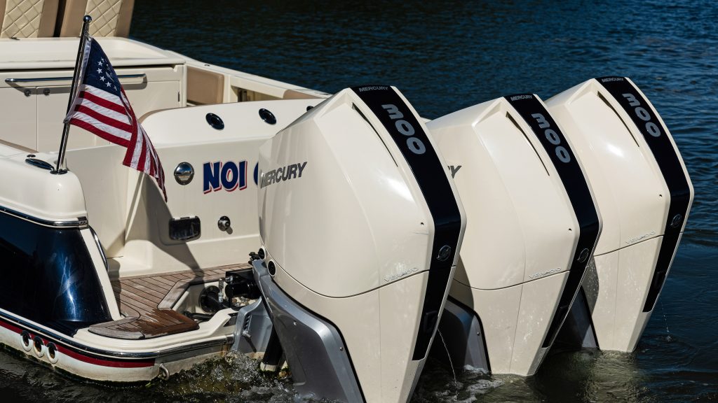 Three Mercury outboard engines on a boat at sea for optimal performance.